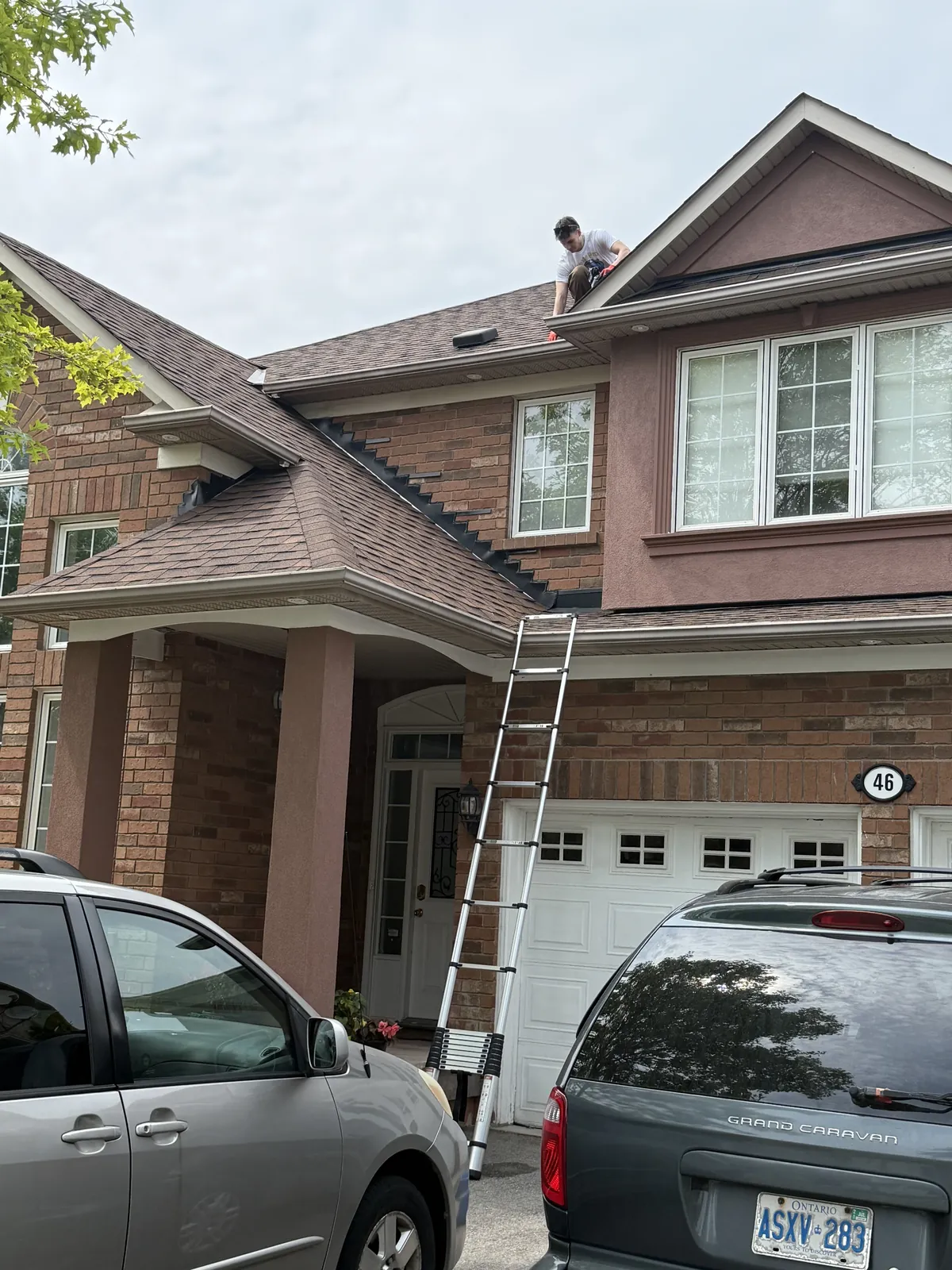 ShinePro technician cleaning front windows on site